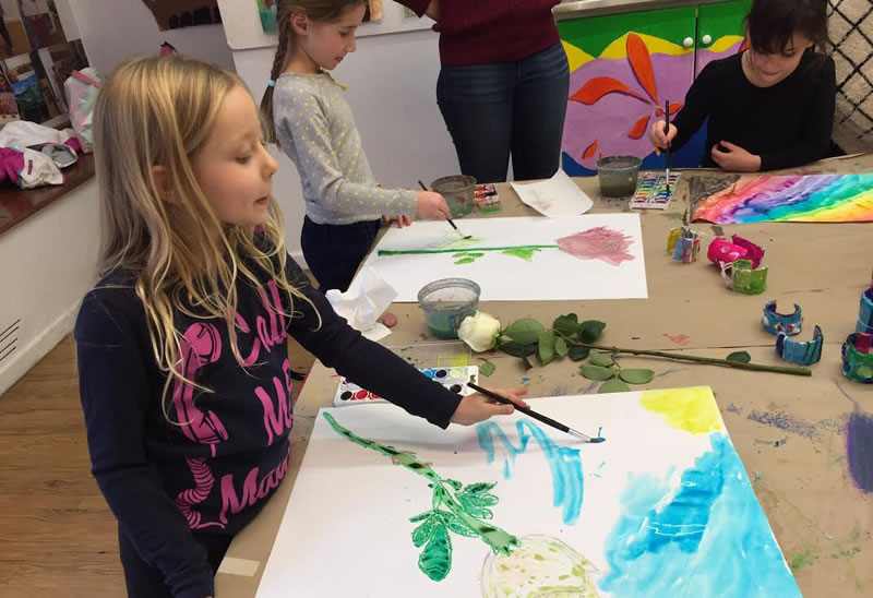 kids painting with watercolors