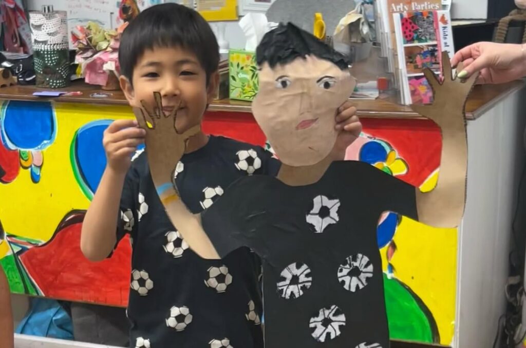 lifesize portrait with soccer ball shirt
