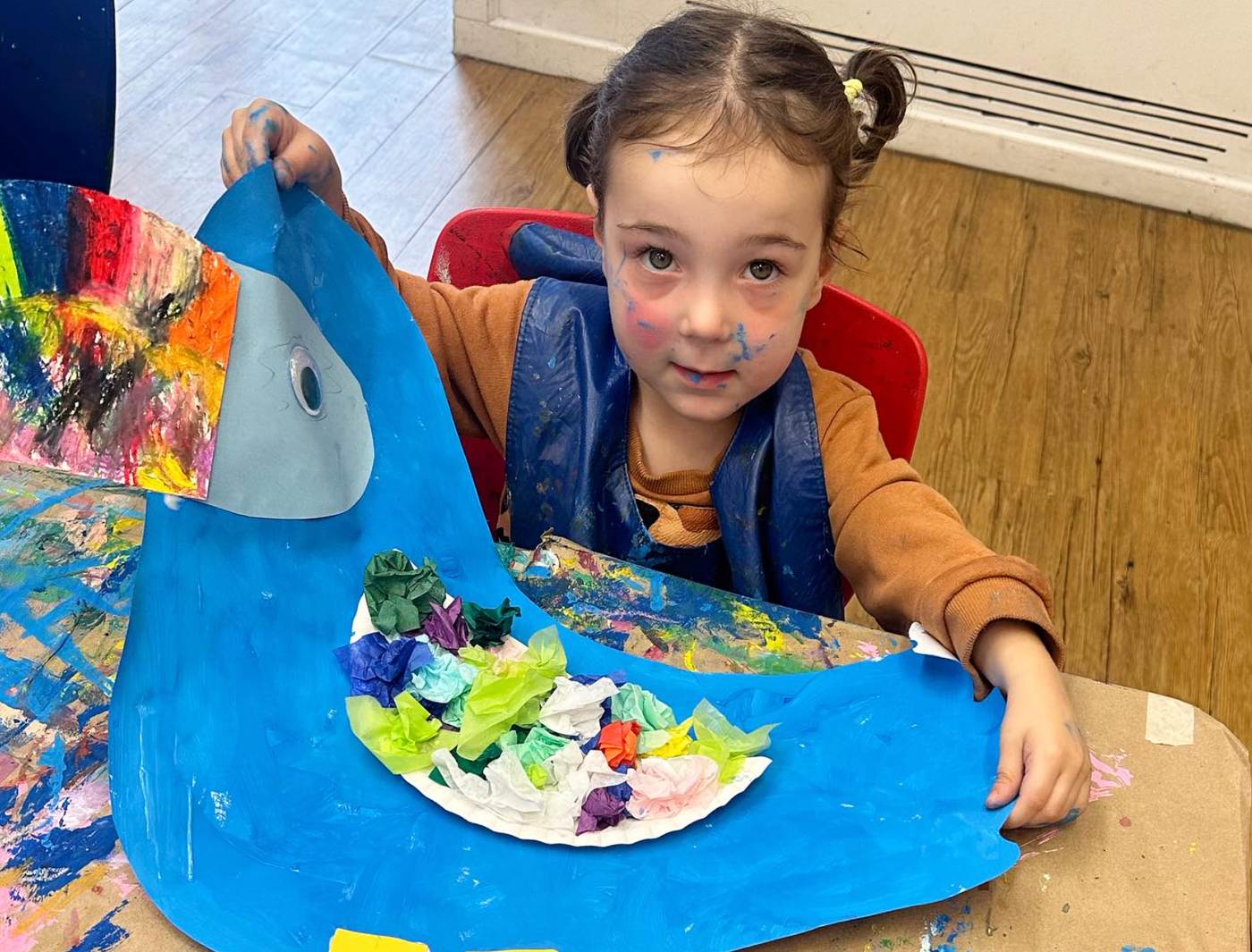 young artist creating bird art